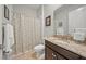 Bathroom featuring tiled floors, granite countertop and shower and tub combination at 11522 Sunburst Marble Rd, Riverview, FL 33579
