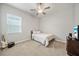 Bedroom featuring a guitar, ceiling fan and television at 11522 Sunburst Marble Rd, Riverview, FL 33579