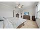 This bedroom offers a ceiling fan and space for a dresser and television at 11522 Sunburst Marble Rd, Riverview, FL 33579