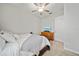 Cozy bedroom featuring a ceiling fan and television on a wooden dresser at 11522 Sunburst Marble Rd, Riverview, FL 33579
