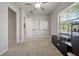Bedroom offering a ceiling fan and space for office equipment at 11522 Sunburst Marble Rd, Riverview, FL 33579