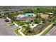 Aerial view of the community center with a pool, playground, and manicured landscaping at 11522 Sunburst Marble Rd, Riverview, FL 33579