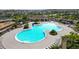 Resort-style pool with ample seating, lush landscaping, and Gathering-friendly playground at 11522 Sunburst Marble Rd, Riverview, FL 33579