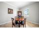 Cozy dining area with a round table and chairs, perfect for enjoying meals with Gathering and friends at 11522 Sunburst Marble Rd, Riverview, FL 33579
