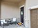 Cozy front porch with stylish outdoor seating, a decorative wreath, and stone accents at 11522 Sunburst Marble Rd, Riverview, FL 33579