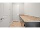 Hallway featuring a granite countertop and tiled floors at 11522 Sunburst Marble Rd, Riverview, FL 33579