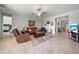 Cozy living room with neutral tones, tile flooring, and comfortable furniture for relaxing or entertaining guests at 11522 Sunburst Marble Rd, Riverview, FL 33579