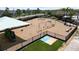 Community playground with swings, climbing structures, and shaded seating areas at 11522 Sunburst Marble Rd, Riverview, FL 33579