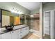 Modern bathroom with walk-in shower, glass enclosure, and sleek vanity at 11559 Captiva Kay Dr, Riverview, FL 33569