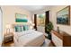 Inviting bedroom featuring a serene view, and tasteful modern decor at 11559 Captiva Kay Dr, Riverview, FL 33569