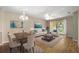 Inviting living room with stylish furnishings, including a comfortable sofa, chairs, and an eye-catching area rug at 11559 Captiva Kay Dr, Riverview, FL 33569