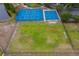 Aerial view of community tennis and basketball courts, next to a multi-purpose playing field and lush landscaping at 11559 Captiva Kay Dr, Riverview, FL 33569