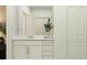 Bathroom featuring a sink, mirror, and storage at 12004 Brae Way, Dade City, FL 33525
