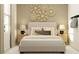 Inviting bedroom with a plush bed, elegant lamps, and stylish decor, creating a serene atmosphere at 12004 Brae Way, Dade City, FL 33525