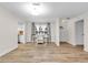 Open-concept dining and living area with stylish floors, offering a seamless flow for entertaining and everyday living at 12946 116Th St, Largo, FL 33778