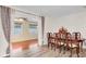 Inviting dining room with a wood table and seating for six, flowing to a sunny adjacent room at 12946 116Th St, Largo, FL 33778