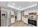 Bright and modern kitchen featuring stainless steel appliances, abundant cabinet space, and stylish countertops, a chef's dream at 12946 116Th St, Largo, FL 33778