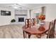 Cozy living room with fireplace, seamlessly connected to the dining area for easy entertaining at 12946 116Th St, Largo, FL 33778
