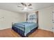 Main bedroom with tile floors and ceiling fan, featuring ample natural light from a window at 12946 116Th St, Largo, FL 33778