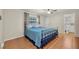 Comfortable main bedroom with tile floors, ceiling fan, and a view of the attached bath at 12946 116Th St, Largo, FL 33778