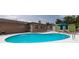 Exterior view of a pool surrounded by a patio with a building attached to the home at 12946 116Th St, Largo, FL 33778