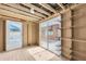 Unfinished room with sliding glass door and wired shelving at 12946 116Th St, Largo, FL 33778