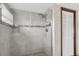 Shower with tiled walls, glass enclosure, and built-in niche offers a modern and stylish bathing space at 12946 116Th St, Largo, FL 33778