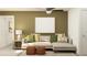 Comfortable seating arrangement in the living room with stylish decor and ample natural light at 13127 Empress Jewel Trl, Parrish, FL 34219