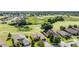 Home in a neighborhood with well-maintained lawns and green spaces at 13238 Chipout Ln, Hudson, FL 34669