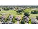 A home is nestled in a community with mature trees, golf course and green space at 13238 Chipout Ln, Hudson, FL 34669