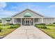 Charming clubhouse exterior with well-maintained landscaping and a welcoming entrance at 13238 Chipout Ln, Hudson, FL 34669