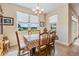 Bright dining area with a large window offering outdoor views and natural light at 13238 Chipout Ln, Hudson, FL 34669