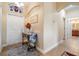 Welcoming front foyer with decorative table and neutral wall color at 13238 Chipout Ln, Hudson, FL 34669