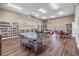 Bright library with bookshelves, tables, and natural light, creating a perfect reading ambiance at 13238 Chipout Ln, Hudson, FL 34669