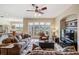 Spacious living room boasts comfortable seating, natural light, and backyard views at 13238 Chipout Ln, Hudson, FL 34669