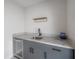 Stylish bar area with marble countertop, mini fridge, and modern cabinetry at 1330 W Gray St # 1, Tampa, FL 33606