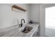 Close up view of the stylish bar area with marble countertop and modern fixtures at 1330 W Gray St # 1, Tampa, FL 33606