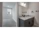 Bathroom with marble countertop vanity and view into the bedroom at 1330 W Gray St # 1, Tampa, FL 33606