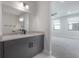 Modern bathroom featuring marble countertop vanity and sleek design at 1330 W Gray St # 1, Tampa, FL 33606