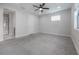 Large bedroom with neutral paint, a ceiling fan, and natural light from the window at 1330 W Gray St # 1, Tampa, FL 33606