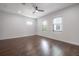 Minimalist bedroom featuring hardwood floors, natural light and neutral walls at 1330 W Gray St # 1, Tampa, FL 33606