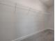 Walk-in closet features carpet flooring and wire shelving for organization at 1330 W Gray St # 1, Tampa, FL 33606