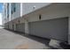 Exterior shot of multiple attached garages with modern doors, showcasing ample parking and storage space for residents at 1330 W Gray St # 1, Tampa, FL 33606