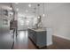 Spacious kitchen featuring a large island, stainless steel appliances, and sleek gray cabinetry at 1330 W Gray St # 1, Tampa, FL 33606
