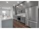 Well-appointed kitchen with stainless steel appliances, stylish cabinetry, and a functional island at 1330 W Gray St # 1, Tampa, FL 33606
