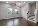 Bright landing area with hardwood floors, staircase, and ample natural light at 1330 W Gray St # 1, Tampa, FL 33606