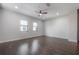 Spacious living room featuring hardwood floors, neutral paint, and large windows, with ample space at 1330 W Gray St # 1, Tampa, FL 33606