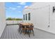 A rooftop deck featuring outdoor furniture, string lights, and sleek railing, perfect for entertaining or relaxing at 1330 W Gray St # 1, Tampa, FL 33606