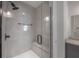 Contemporary glass enclosed shower with built-in bench, and light-colored tiles at 1330 W Gray St # 1, Tampa, FL 33606