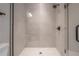 Close up view of the walk-in shower featuring modern tile and black fixtures at 1330 W Gray St # 1, Tampa, FL 33606